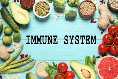 Image of Immune system boosting with proper nutrition. Different foods on light blue wooden table, flat lay