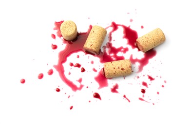 Photo of Bottle corks with wine stains on white background, top view