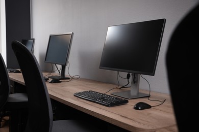 Photo of Many modern computers in open space office