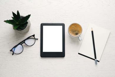 Photo of Flat lay composition with modern e-book reader on white wooden table