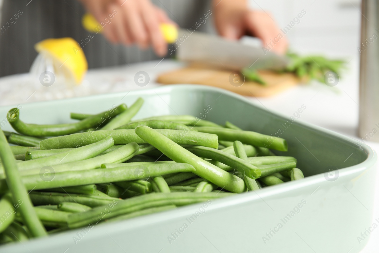 Photo of Raw green beans in baking dish, closeup