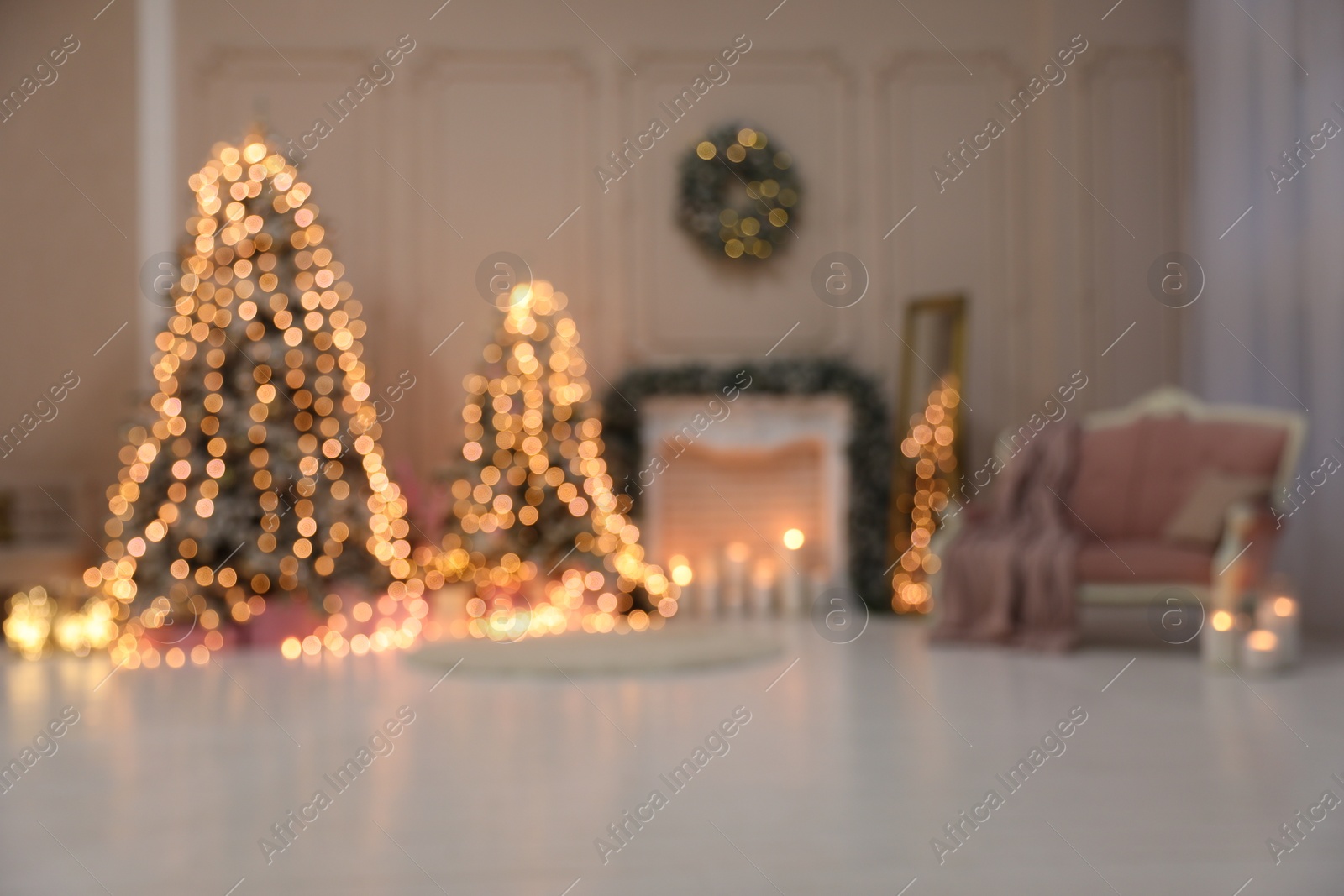 Photo of Blurred view of festive room interior with Christmas trees