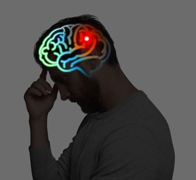 Image of Amnesia. Thoughtful man with illustration of brain on grey background