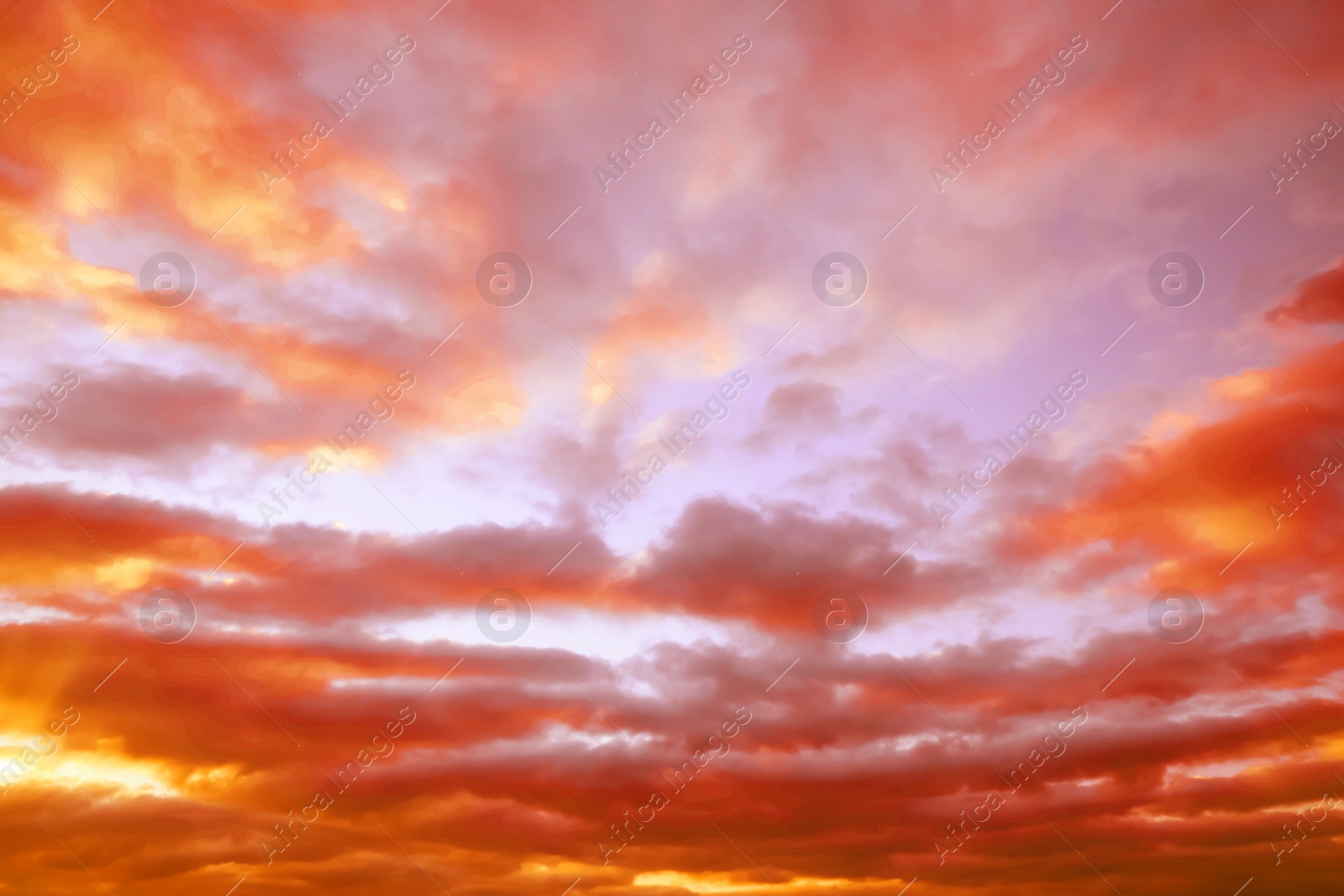 Image of Beautiful view of orange sky with clouds at sunset