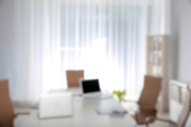 Photo of Modern brightly lit office with bokeh effect