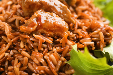 Photo of Tasty brown rice with meat as background, closeup