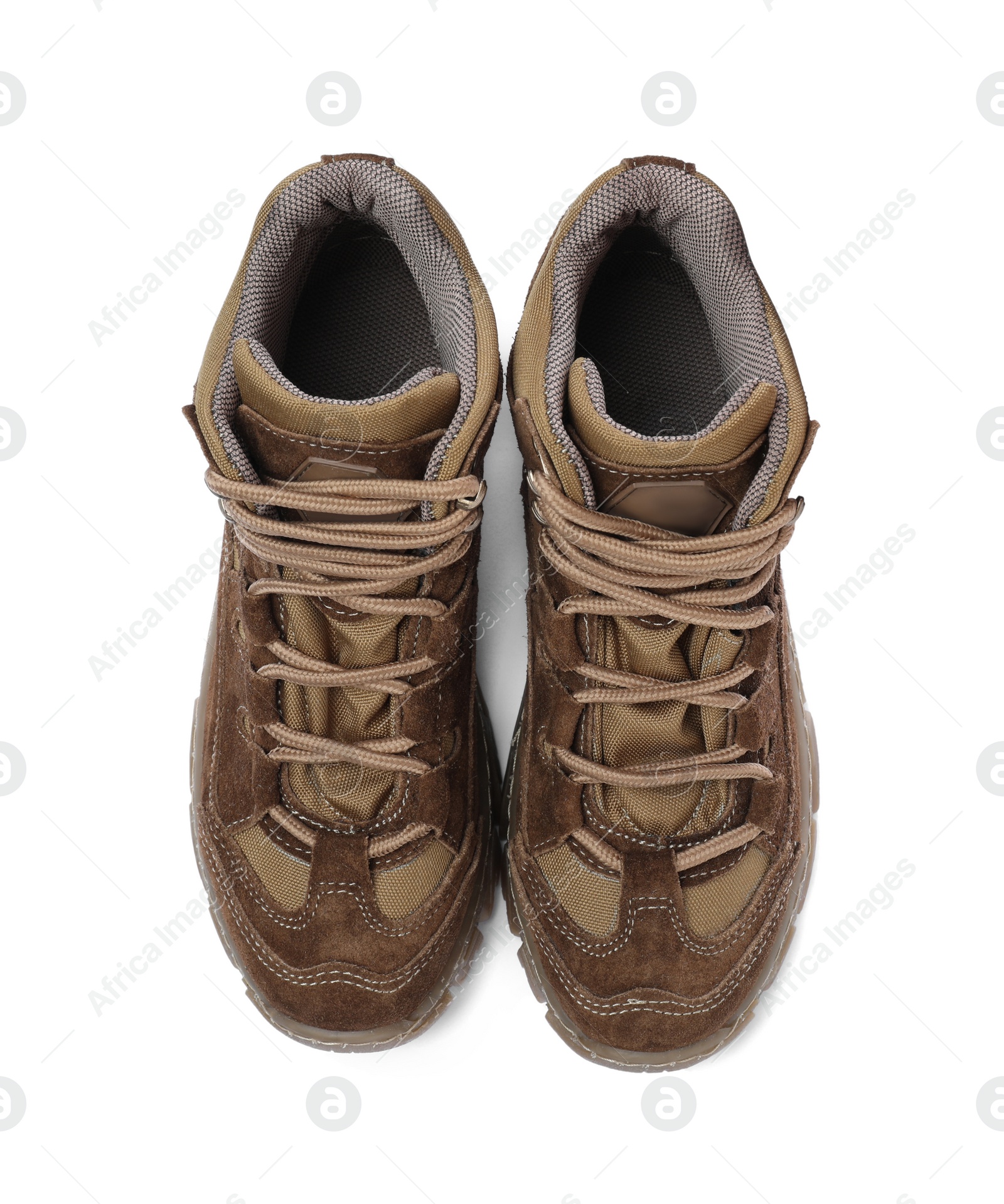 Photo of Pair of comfortable hiking boots on white background, top view. Camping tourism