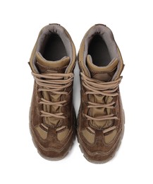 Pair of comfortable hiking boots on white background, top view. Camping tourism