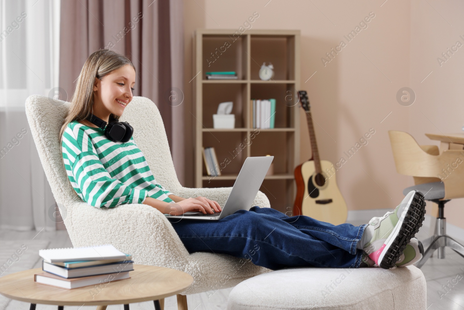 Photo of Online learning. Teenage girl with laptop at home