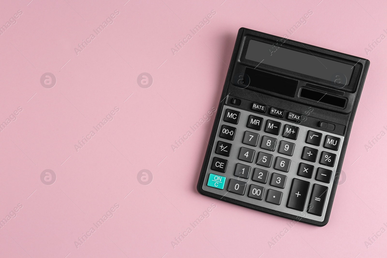 Photo of Modern calculator on pink background, top view. Space for text