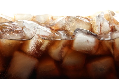 Photo of Closeup view of tasty refreshing cola with ice cubes on white background