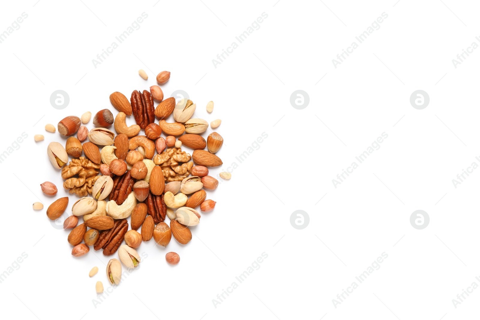 Photo of Different delicious nuts on white background, flat lay. Space for text