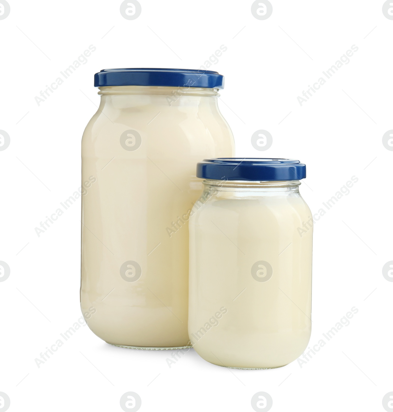 Photo of Fresh mayonnaise sauce in glass jars isolated on white