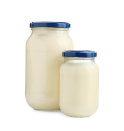 Photo of Fresh mayonnaise sauce in glass jars isolated on white