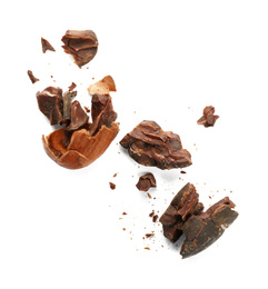 Photo of Broken cocoa bean on white background, top view