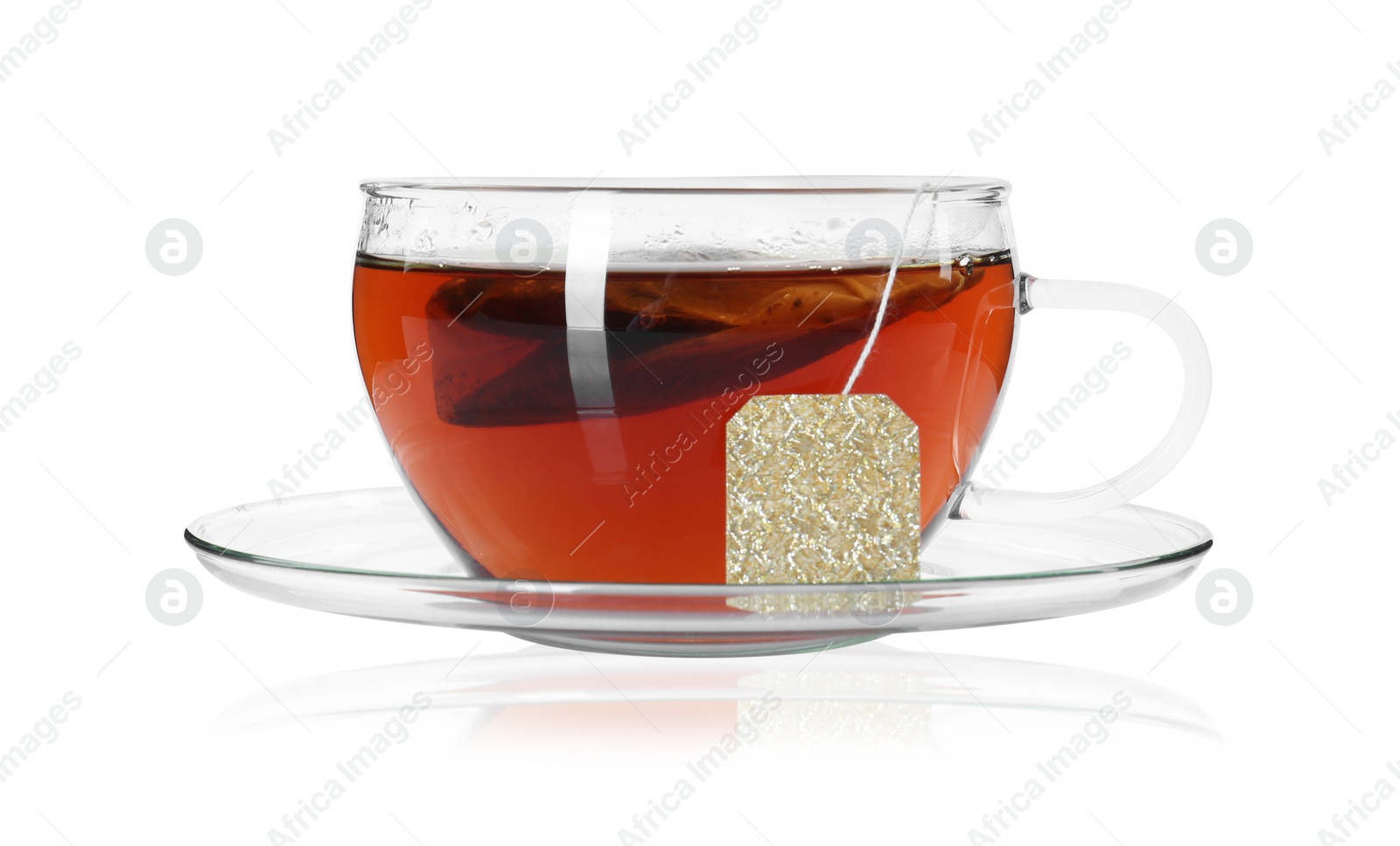 Photo of Brewing aromatic tea. Cup with teabag isolated on white