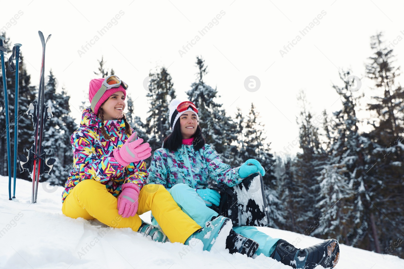 Photo of Friends with equipment on snowy hill. Winter vacation