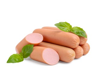 Photo of Whole and cut delicious boiled sausages with basil on white background