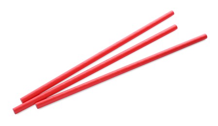 Red paper cocktail straws on white background