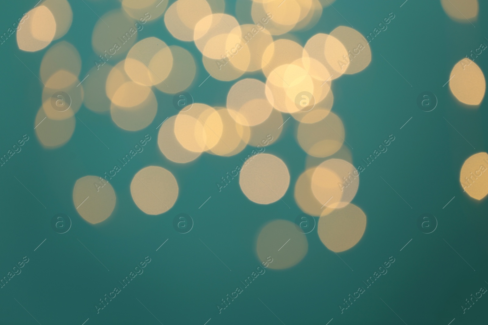 Photo of Blurred view of beautiful lights on blue background