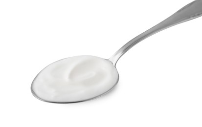 Delicious natural yogurt in spoon isolated on white