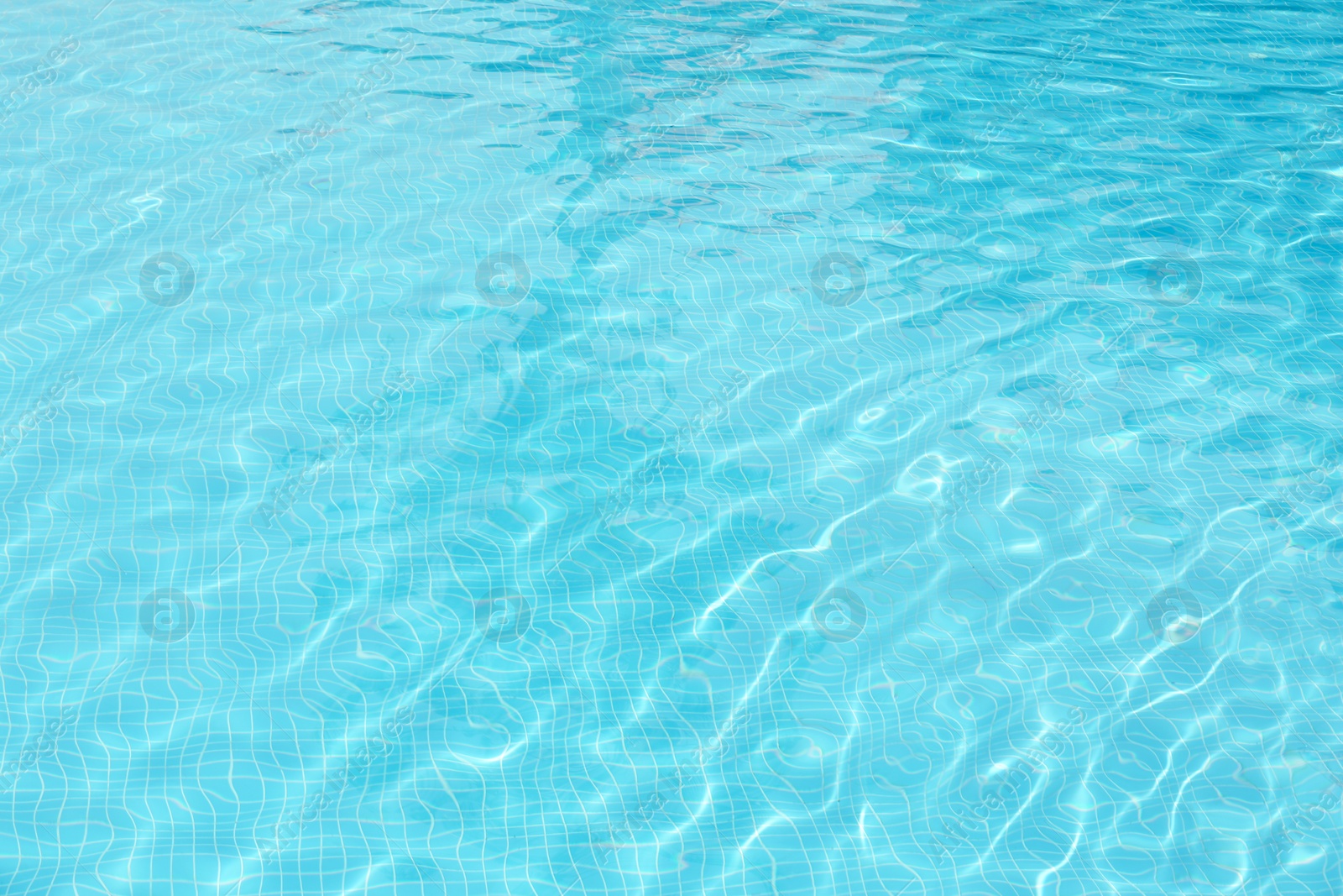 Photo of Clear refreshing water in swimming pool, closeup