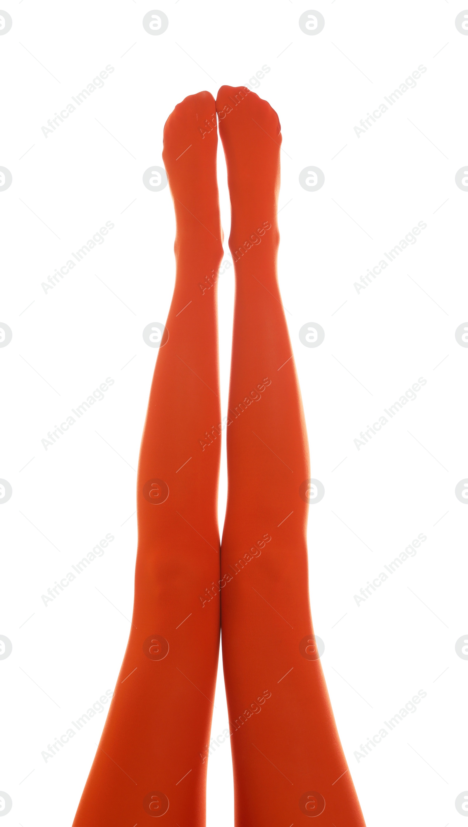Photo of Woman wearing terracotta tights on white background, closeup of legs