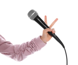 Photo of Child holding microphone on white background, closeup