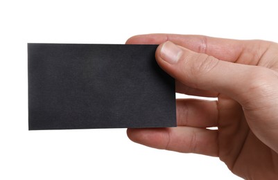 Photo of Man holding blank business card on white background, closeup