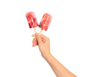 Photo of Woman holding berry popsicles on white background, closeup