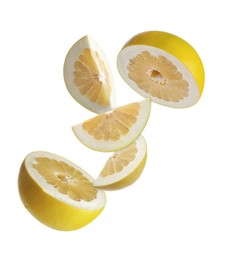 Fresh pomelo fruit falling on white background