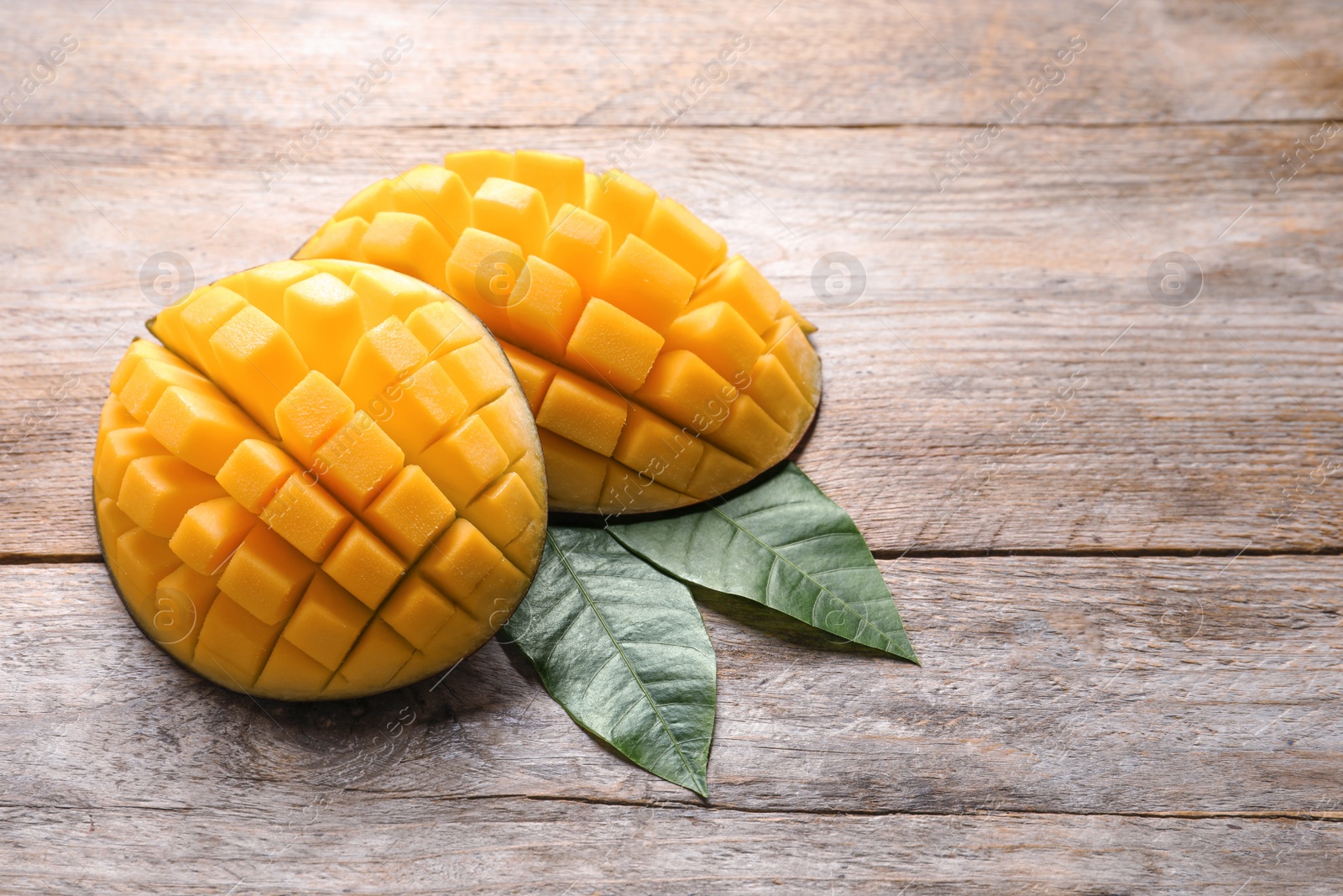 Photo of Composition with fresh mango and space for text on wooden background