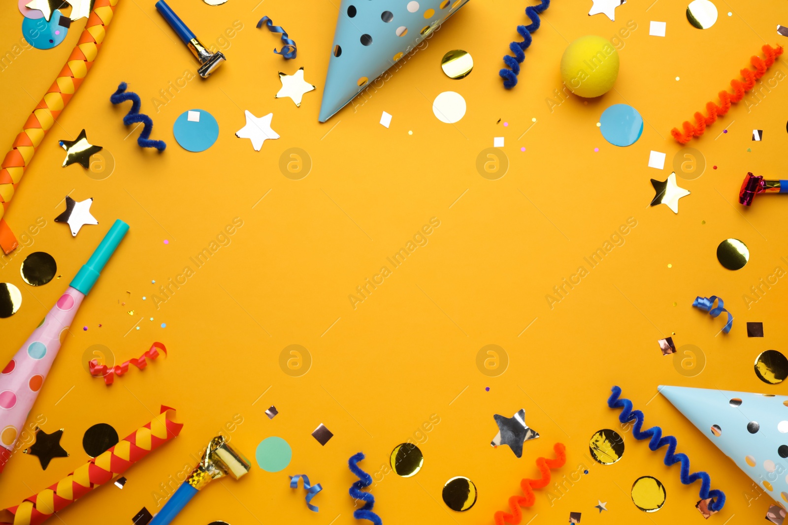 Photo of Frame of party items on orange background, flat lay. Space for text