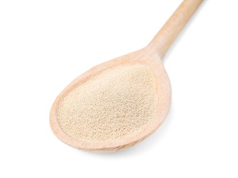 Wooden spoon with granulated yeast isolated on white