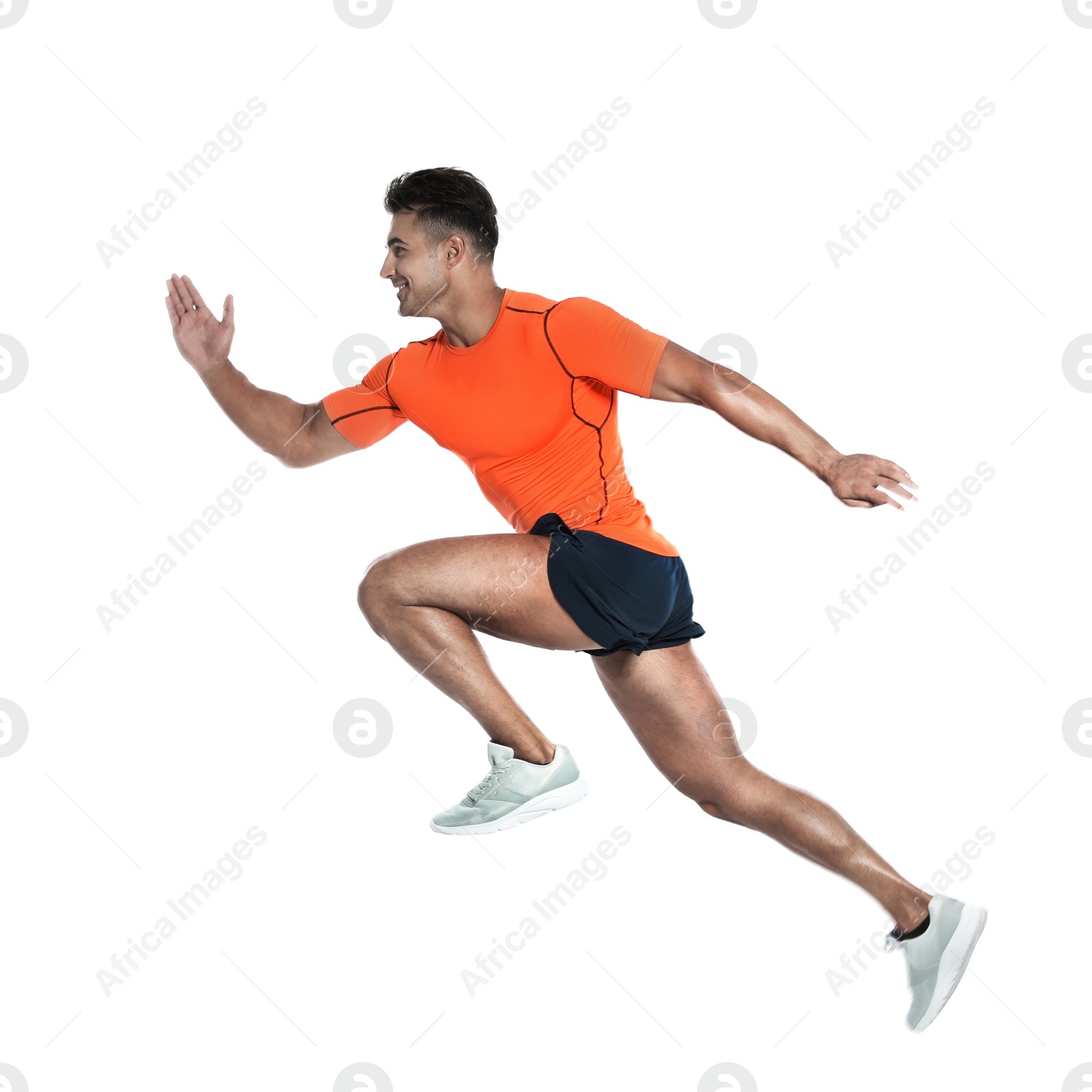 Photo of Handsome young man running on white background