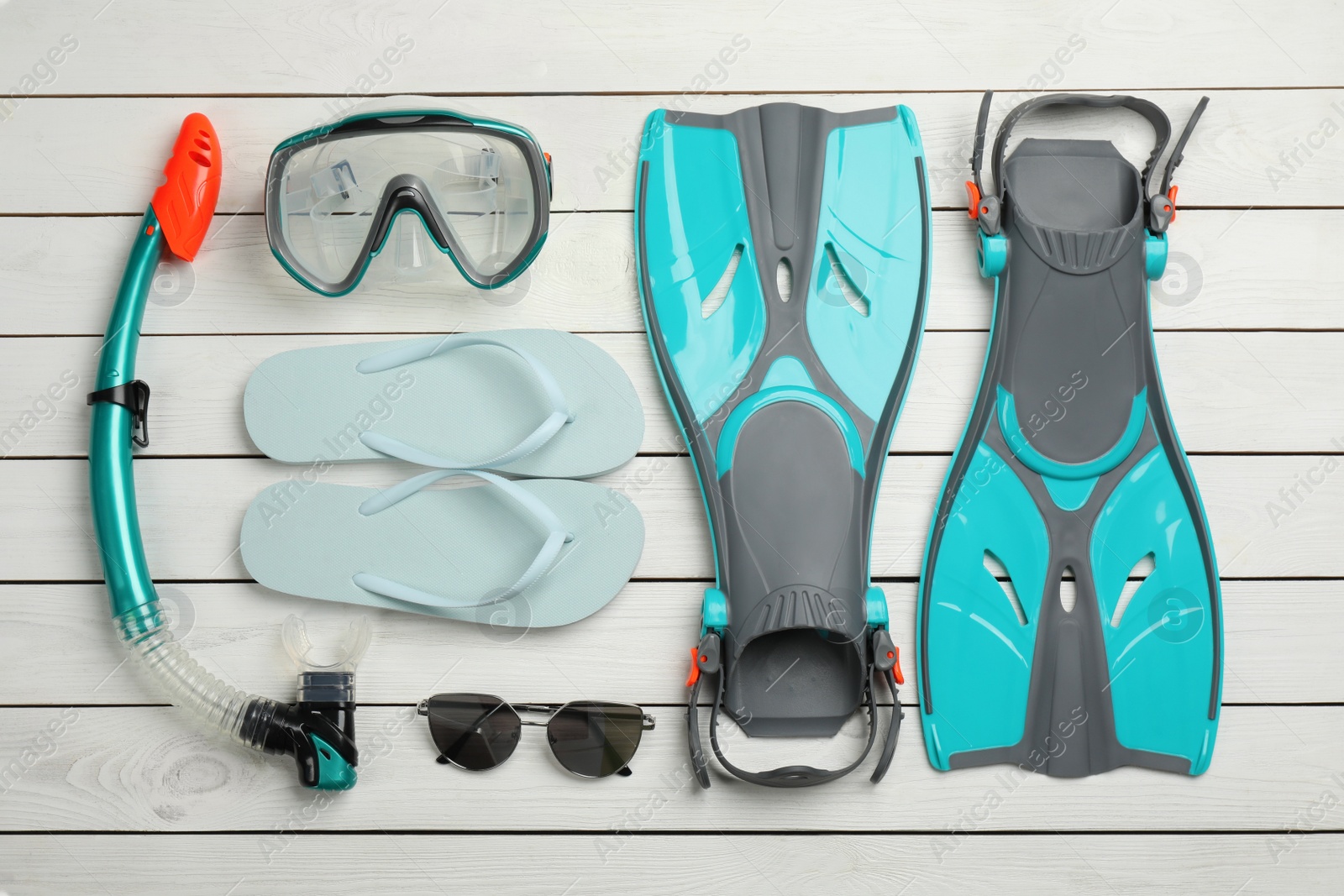 Photo of Flat lay composition with beach objects on white wooden background