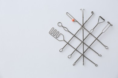 Photo of Set of logopedic probes on white background, top view. Speech therapist's tools