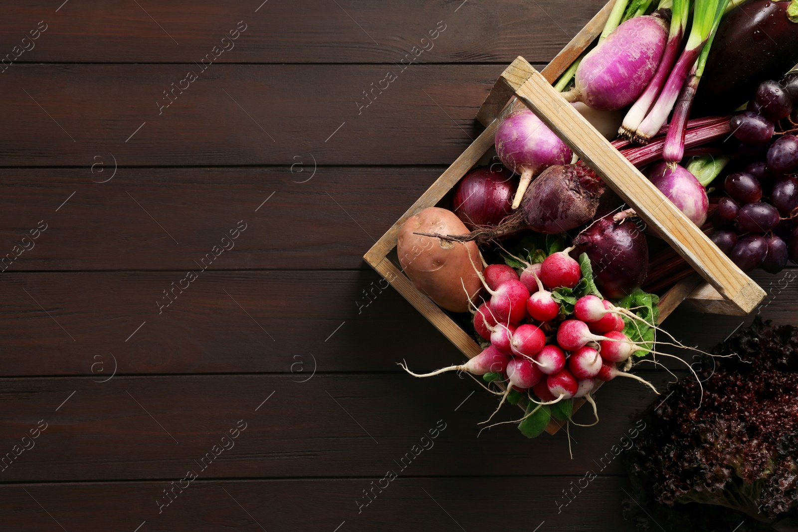 Photo of Different fresh ripe vegetables on wooden table, flat lay. Space for text