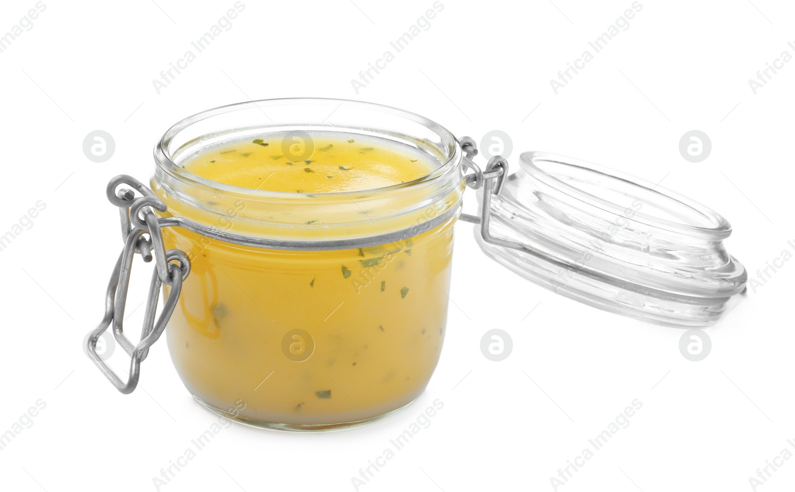 Photo of Jar with lemon sauce on white background. Delicious salad dressing