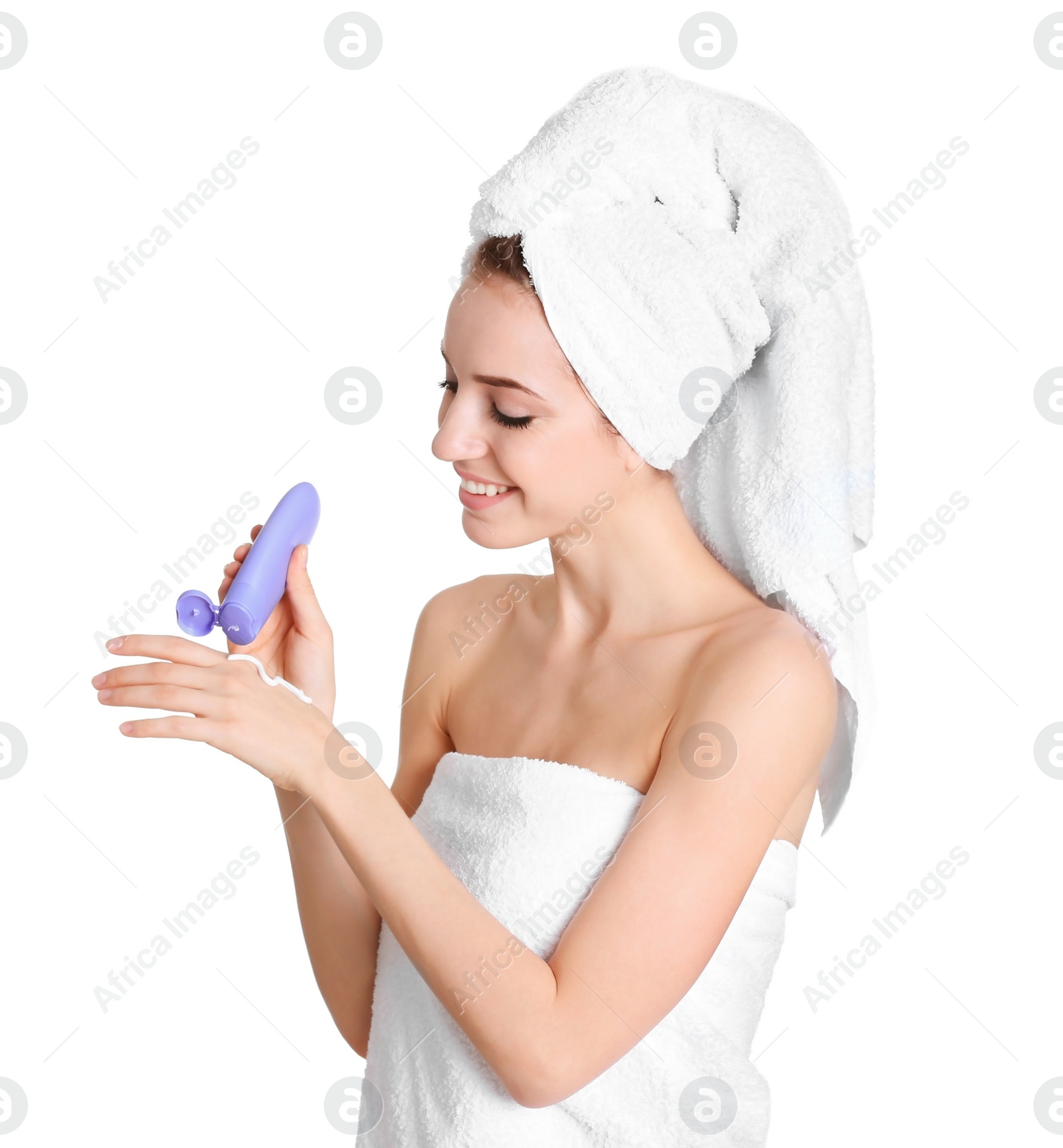 Photo of Young woman applying hand cream on white background