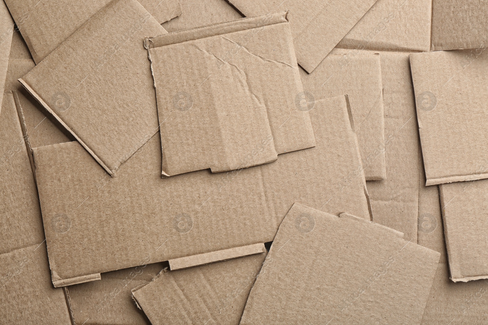 Photo of Pieces of cardboard as background, top view. Recycling concept