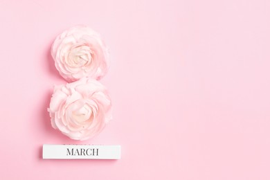 Photo of International Women's day. 8th of March made with beautiful flowers on light pink background, top view. Space for text