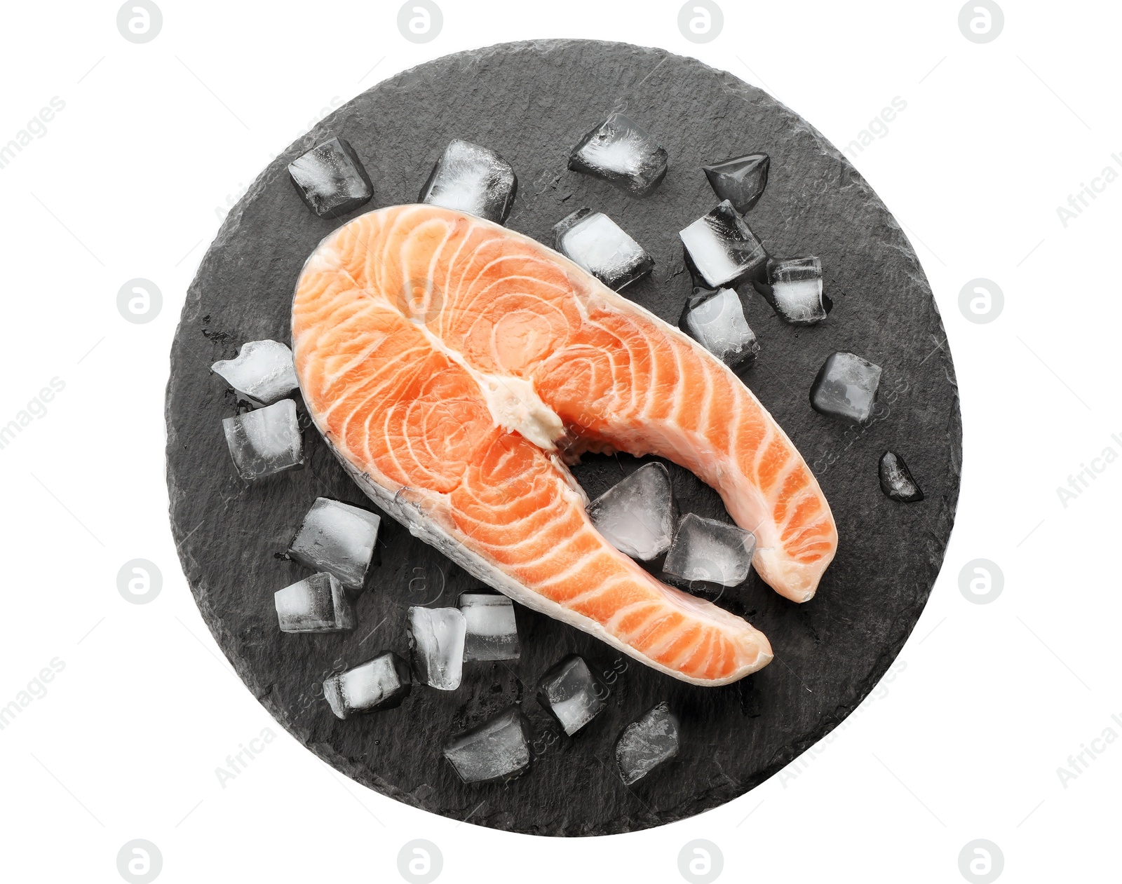 Photo of Slate plate with fresh raw salmon steak and ice cubes on white background, top view