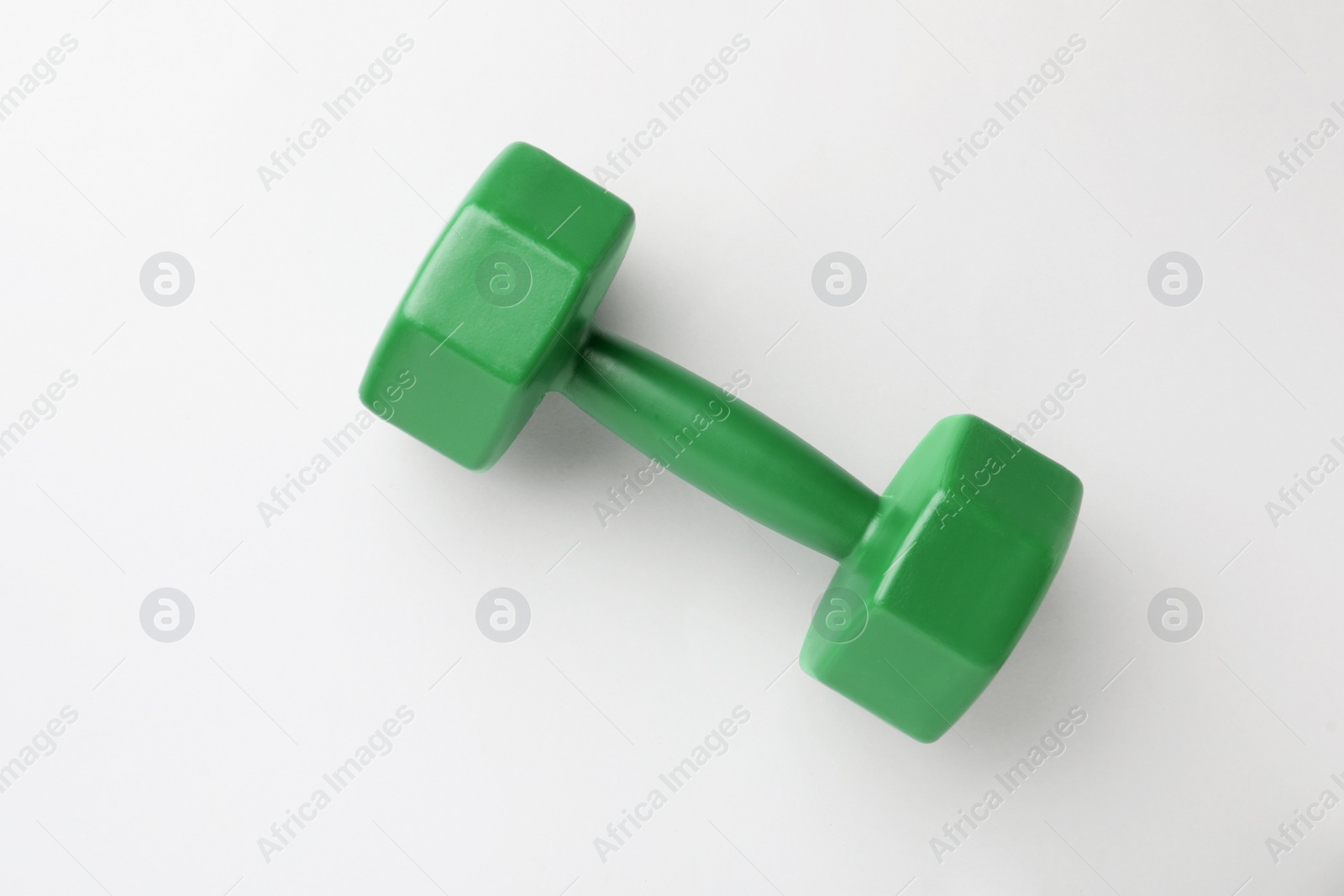 Photo of Green vinyl dumbbell on light background, top view