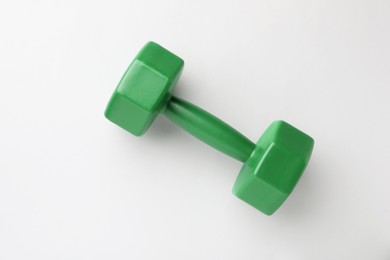 Photo of Green vinyl dumbbell on light background, top view