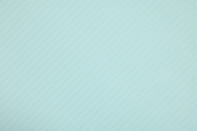 Stylish light turquoise wallpaper as background, closeup