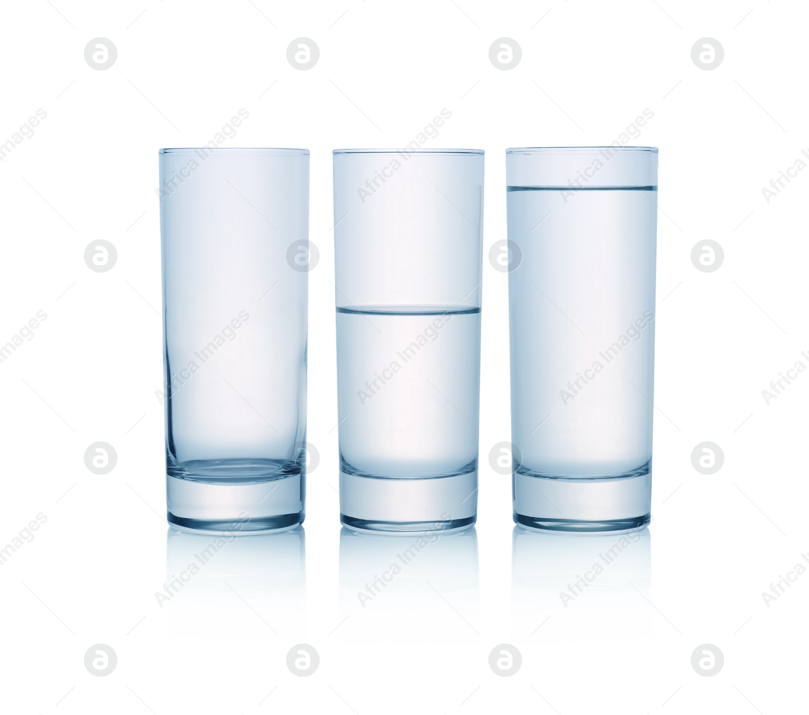 Photo of Empty, half full and full glasses of water on white background