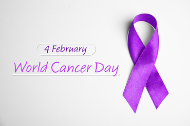 Purple ribbon on white background, top view. World Cancer Day
