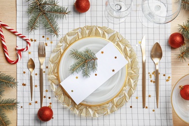 Photo of Elegant table setting on cloth, top view. Christmas celebration