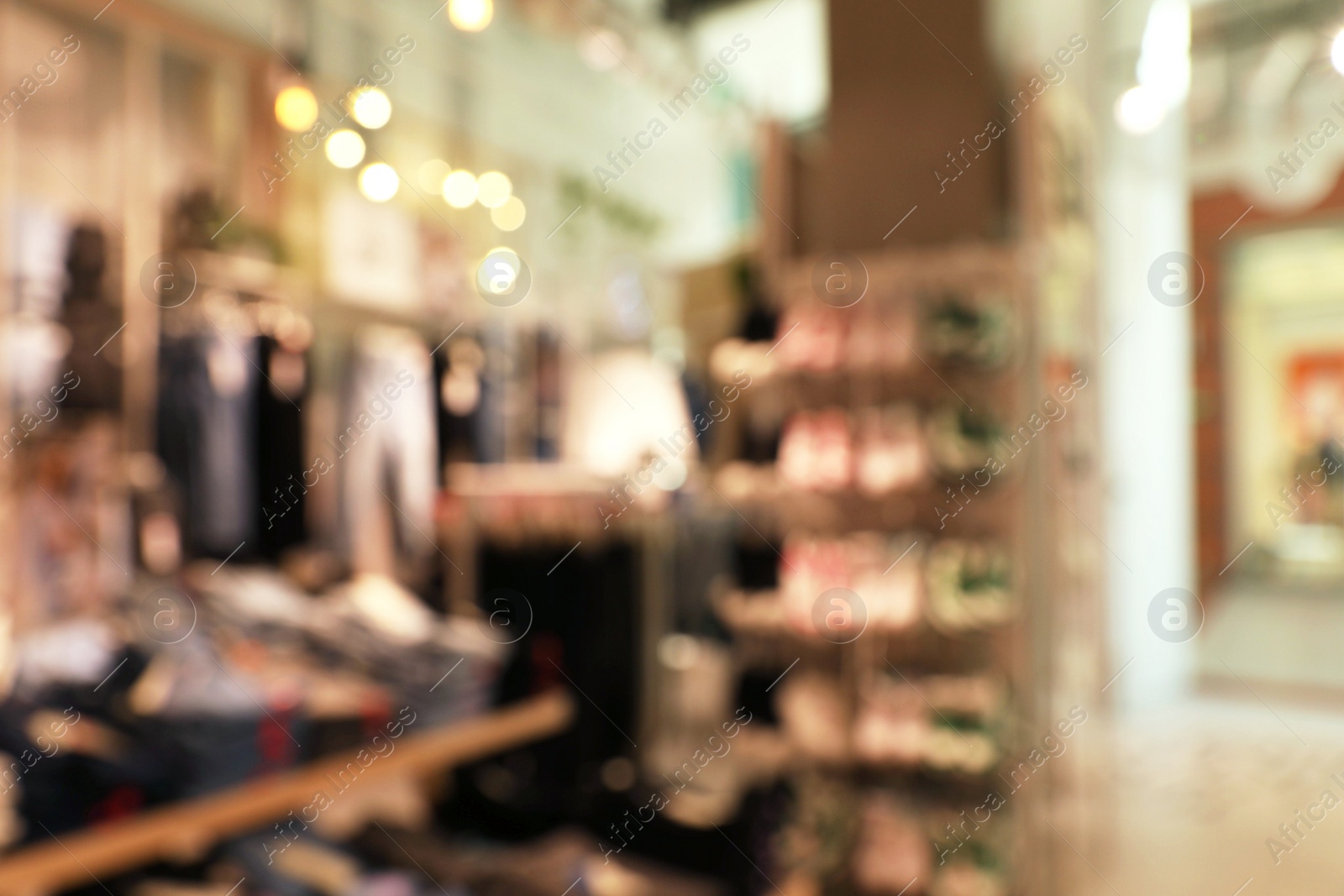 Photo of Blurred view of store interior in shopping mall. Bokeh effect